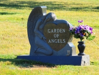 Crafted head stone and flowers
